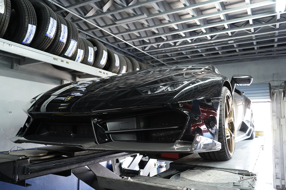 Technician using a diagnostic scanner on a vehicle
