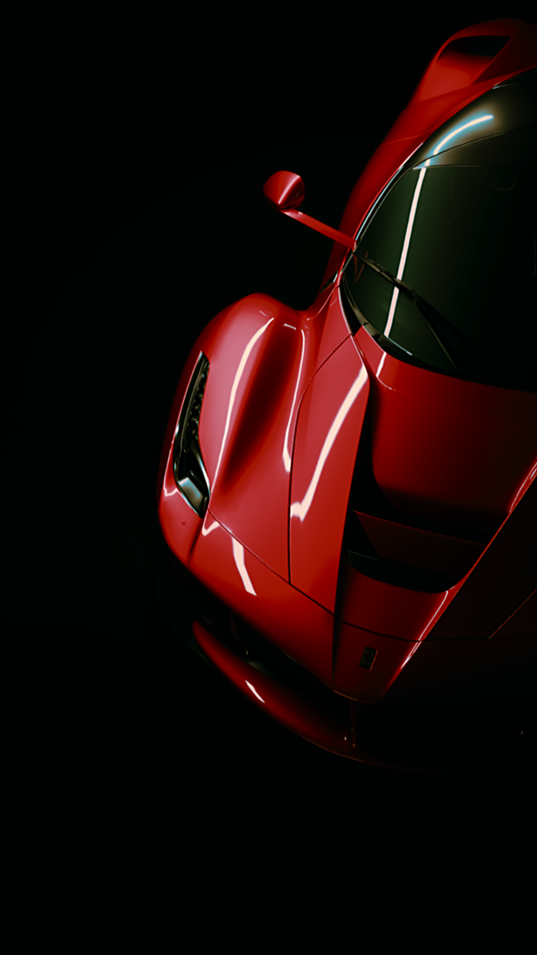 Red Ferrari supercar in dramatic studio lighting